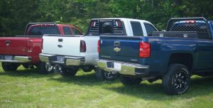 Red Dodge, White Ford, and Blue Chevy